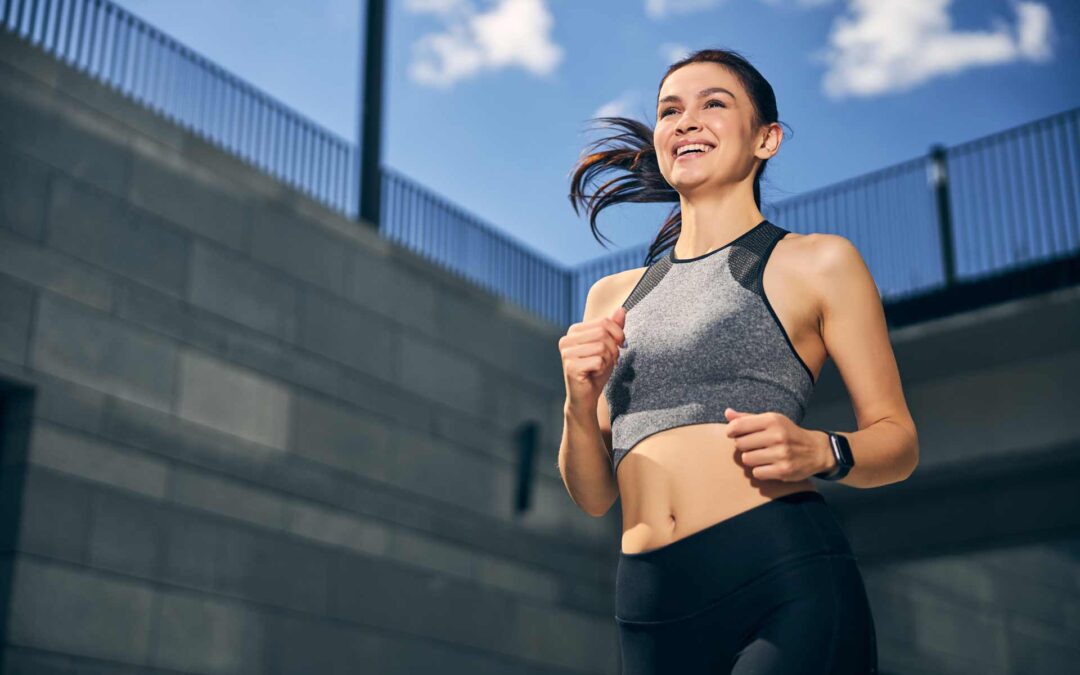 Positive delighted young woman running with pleasure